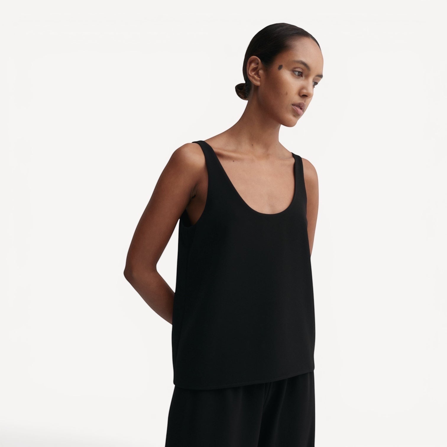 Lula Studio Prague black crepe acetate blend tank top with scooped neckline and back, relaxed fit.