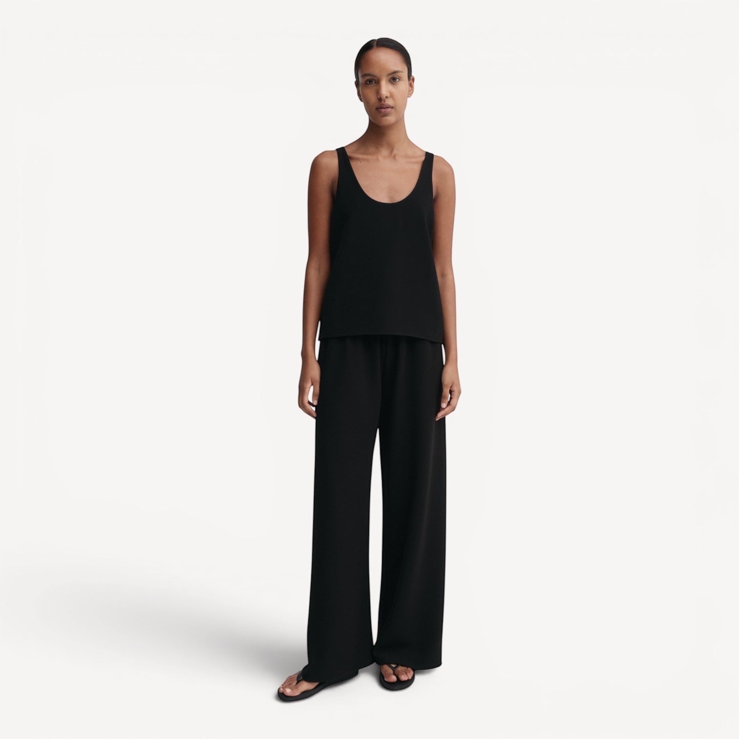 Lula Studio Prague black crepe tank top with scooped neckline and wide-leg trousers.