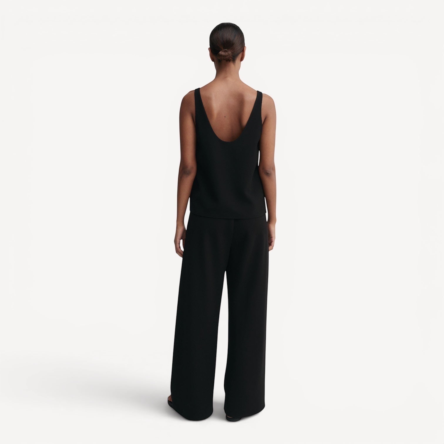 Lula Studio Prague black crepe top with deep scoop neckline and back, loose silhouette, matte finish.