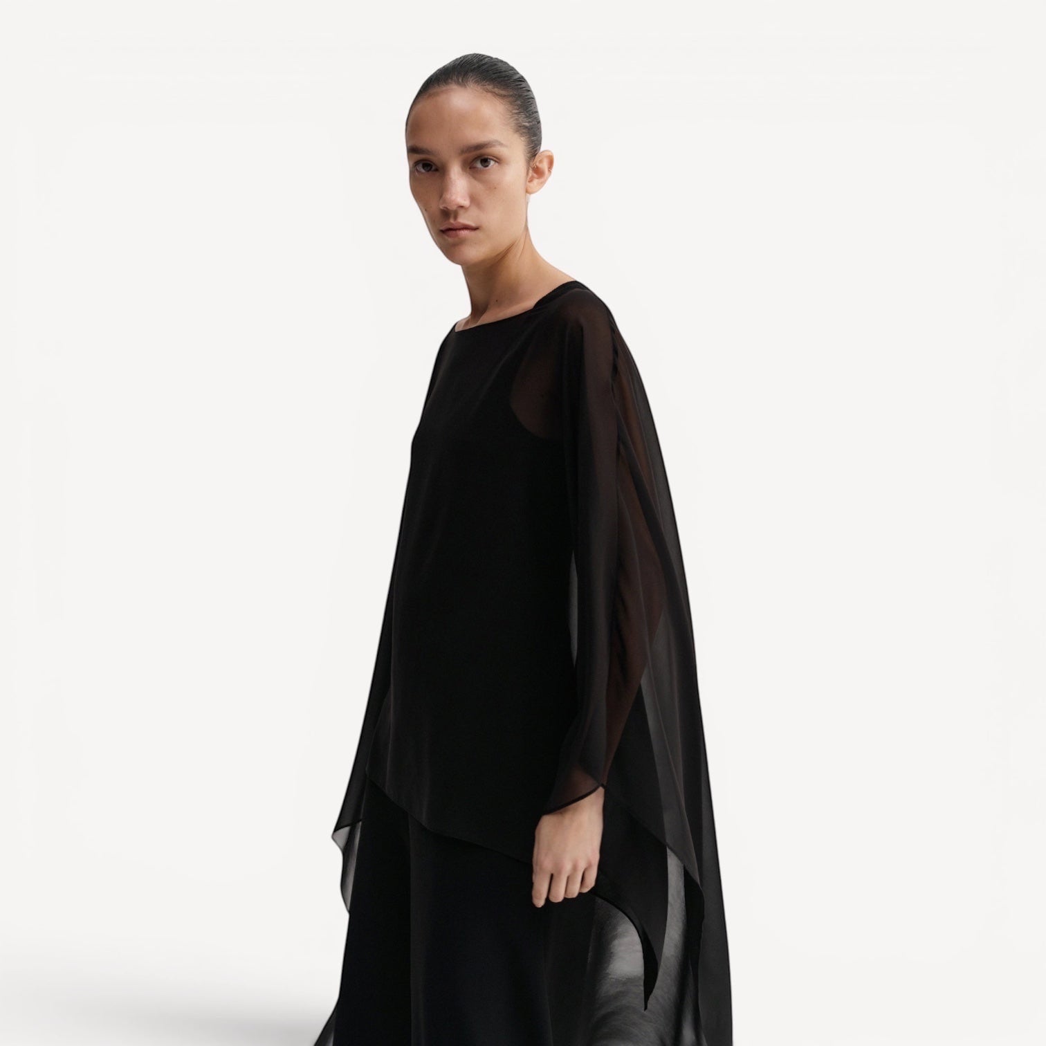 Lula Studio Prague black silk chiffon cape with asymmetric hem and boatneck, flowing and sheer.