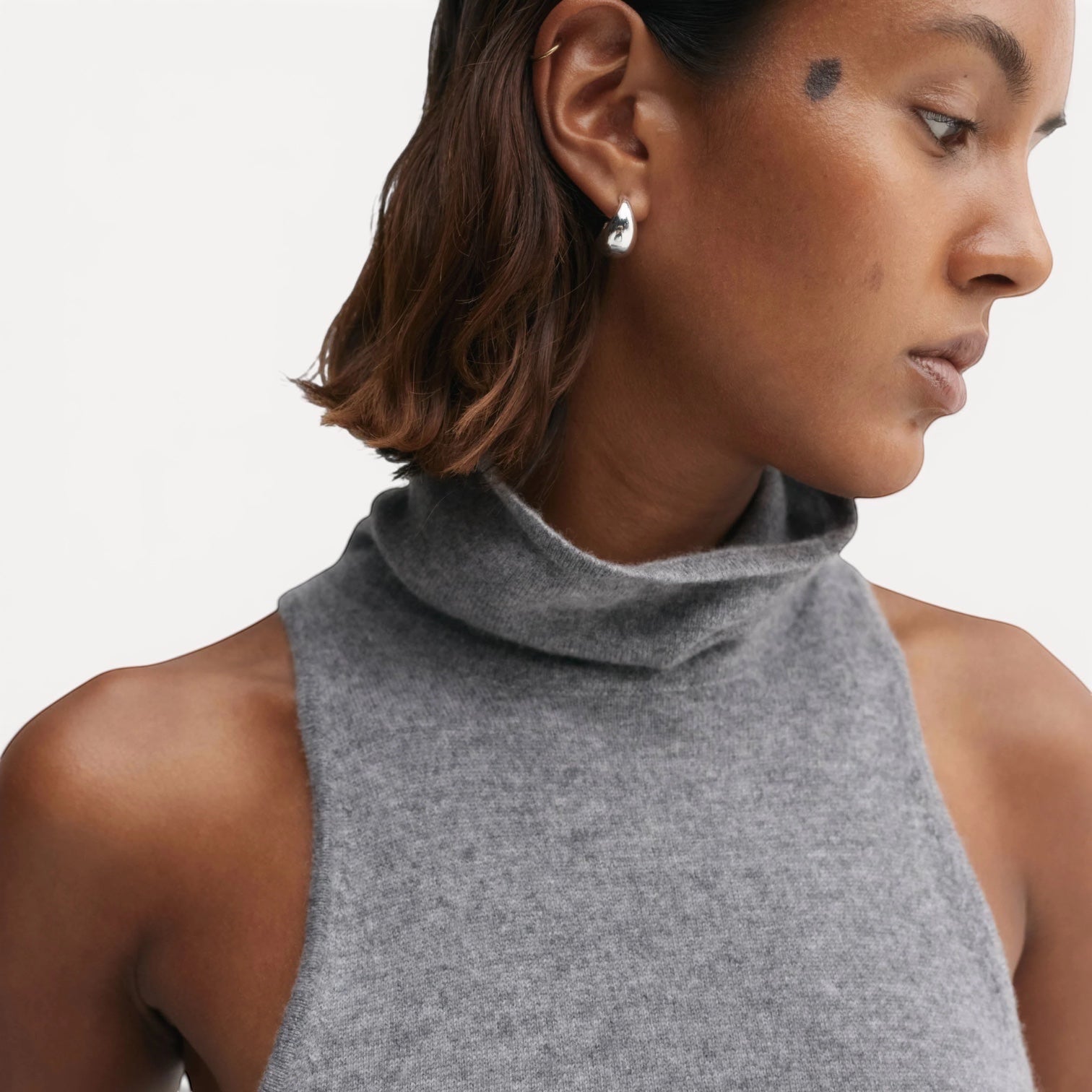 Lula Studio Prague grey cashmere sleeveless turtleneck top with a high neckline and racerback detail.