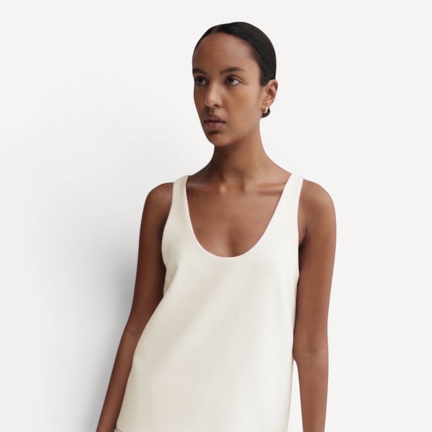 Lula Studio Prague Romy Crepe Top in cream. Sleeveless tank with a relaxed silhouette, scooped neckline and back.
